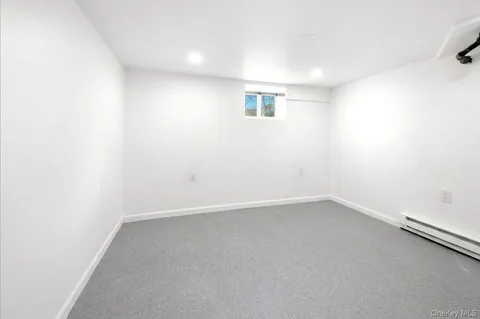 an empty room with a empty space and window