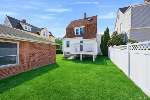 a view of an house with backyard space and garden