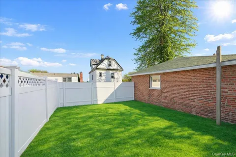 a view of a backyard with potted plants