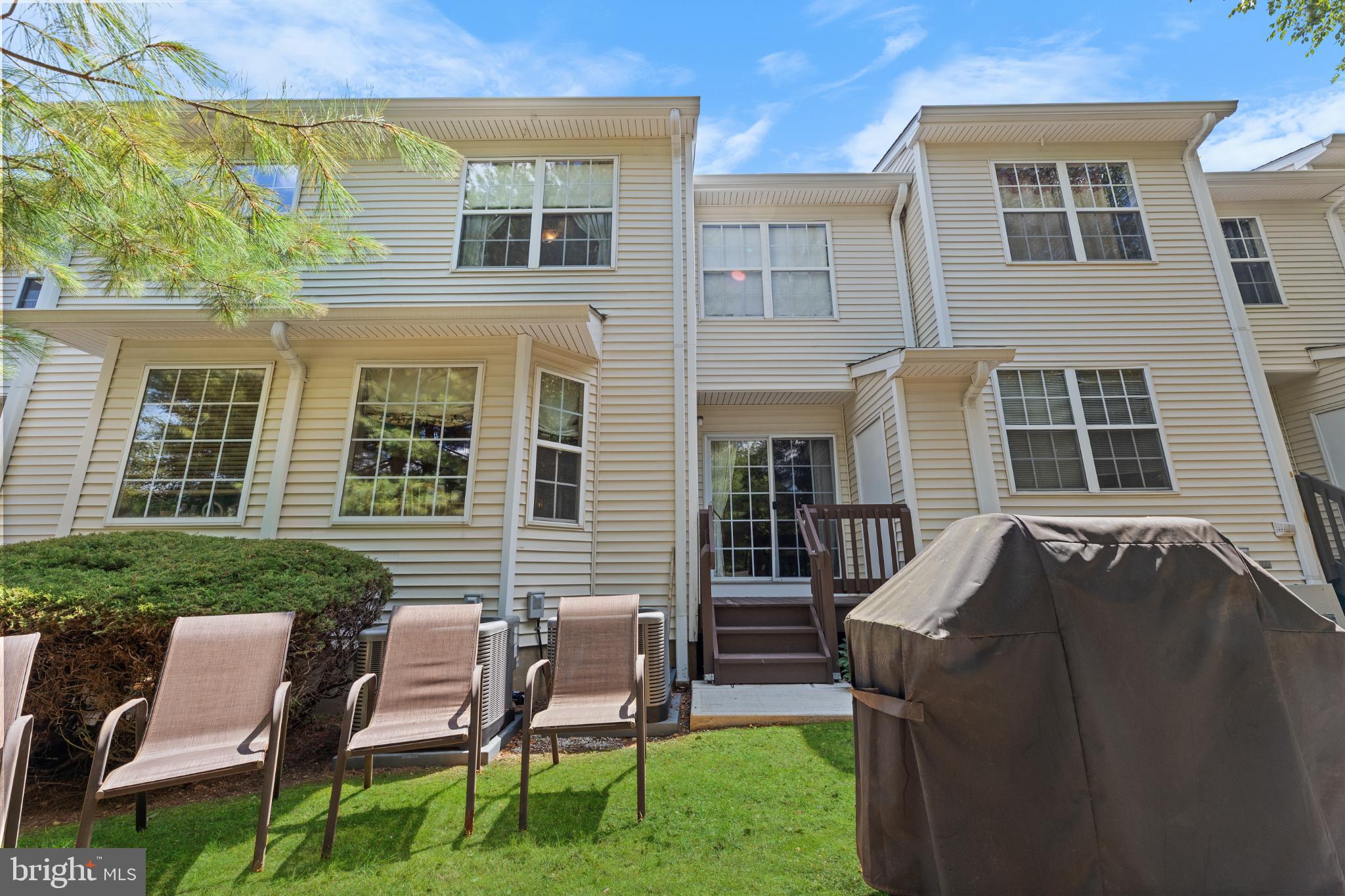 28 Garfield Way Princeton, NJ 08540 - Photo 25 of 38 a front view of a house with a garden and patio
