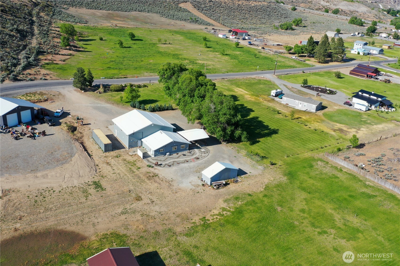 46 Shumway Road Omak, WA 98841 - Photo 36 of 40 an aerial view of a house with a yard basket ball court