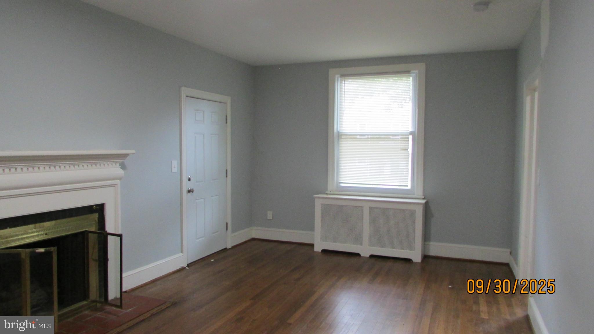 4501 Beechwood Road College Park, MD 20740 - Photo 15 of 57 a view of an empty room with wooden floor and a window
