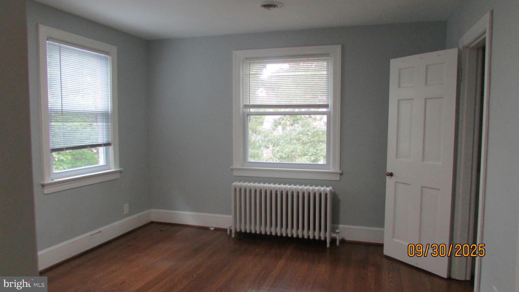 4501 Beechwood Road College Park, MD 20740 - Photo 40 of 57 an empty room with wooden floor and windows