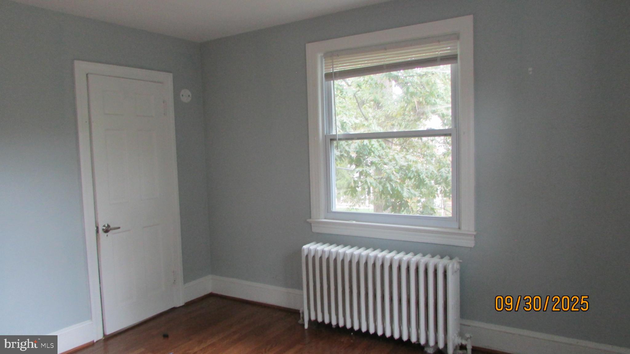 4501 Beechwood Road College Park, MD 20740 - Photo 48 of 57 a view of an empty room with wooden floor and a window