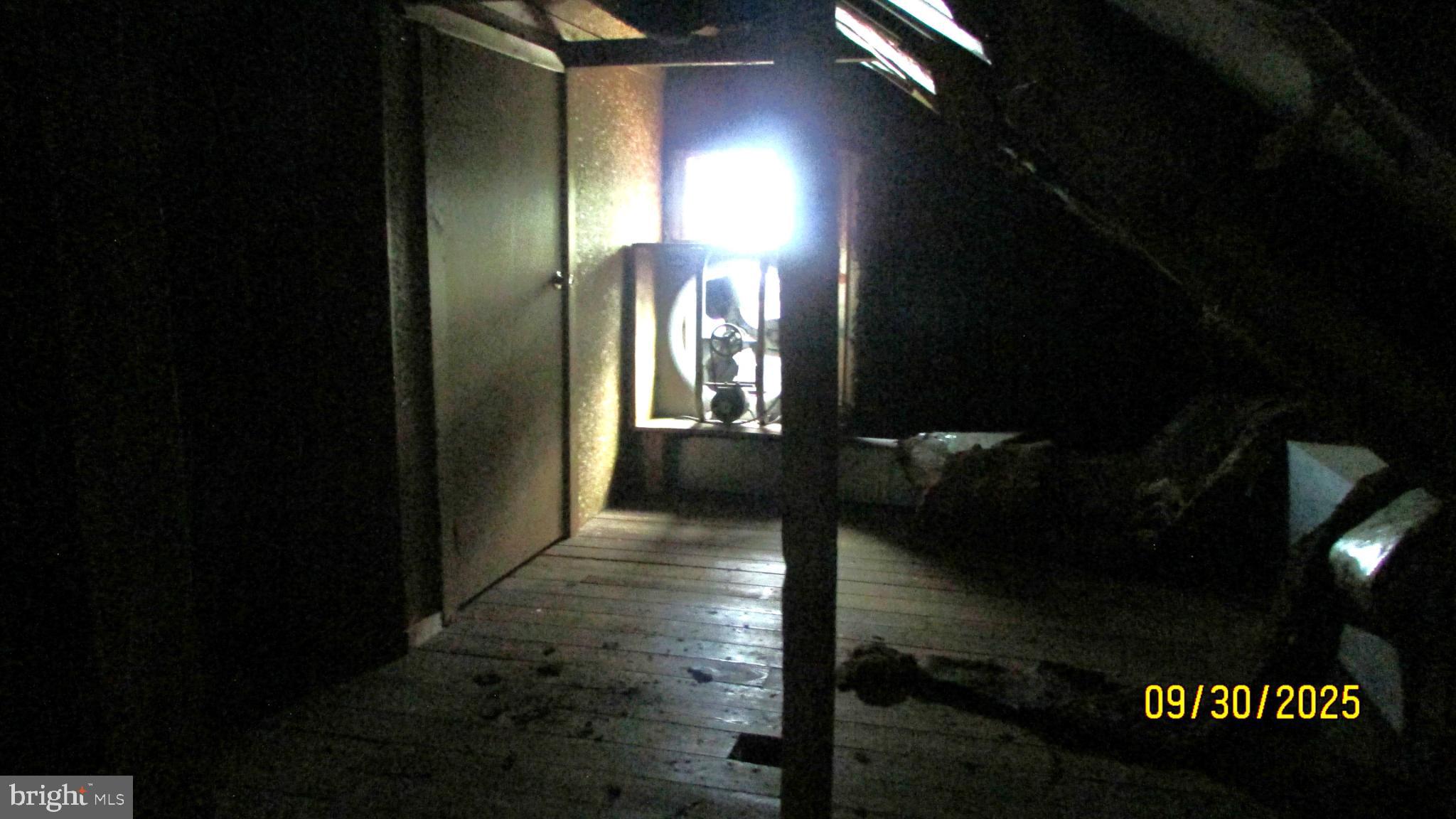 4501 Beechwood Road College Park, MD 20740 - Photo 54 of 57 Mysterious attic bathed in soft light.