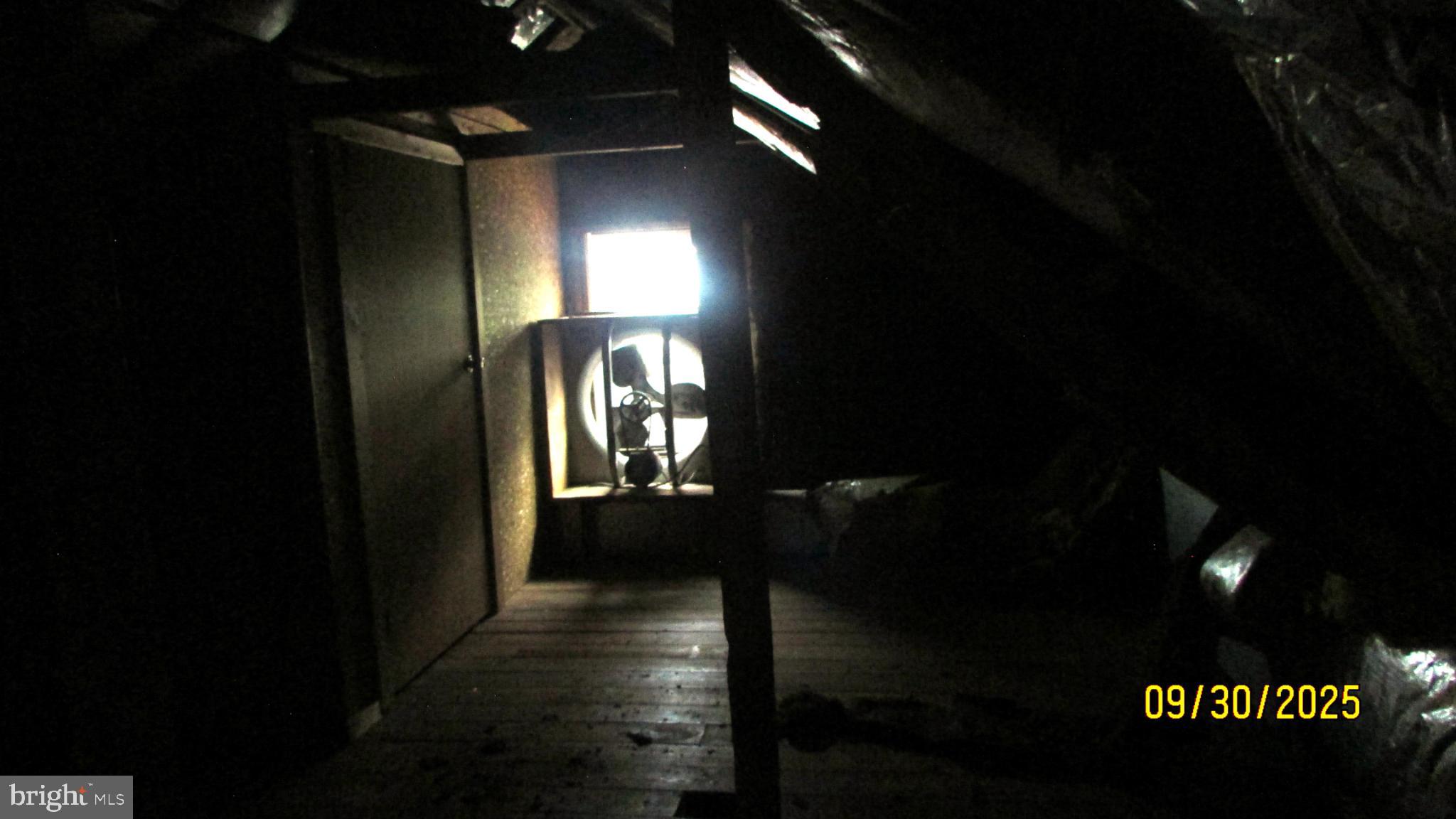 4501 Beechwood Road College Park, MD 20740 - Photo 56 of 57 Mysterious attic with a glowing window.