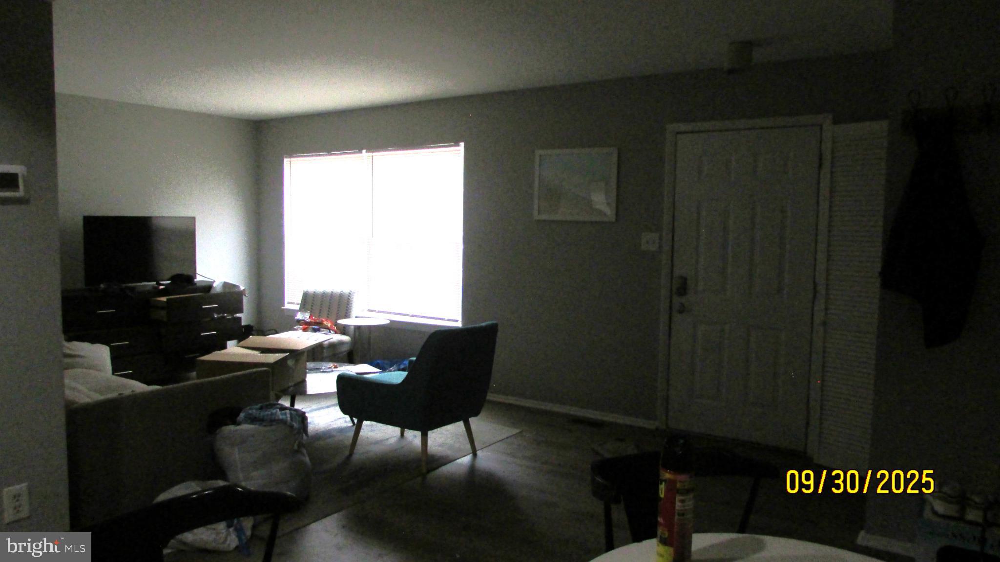 4501 Beechwood Road College Park, MD 20740 - Photo 57 of 57 a living room with furniture a flat screen tv and a window