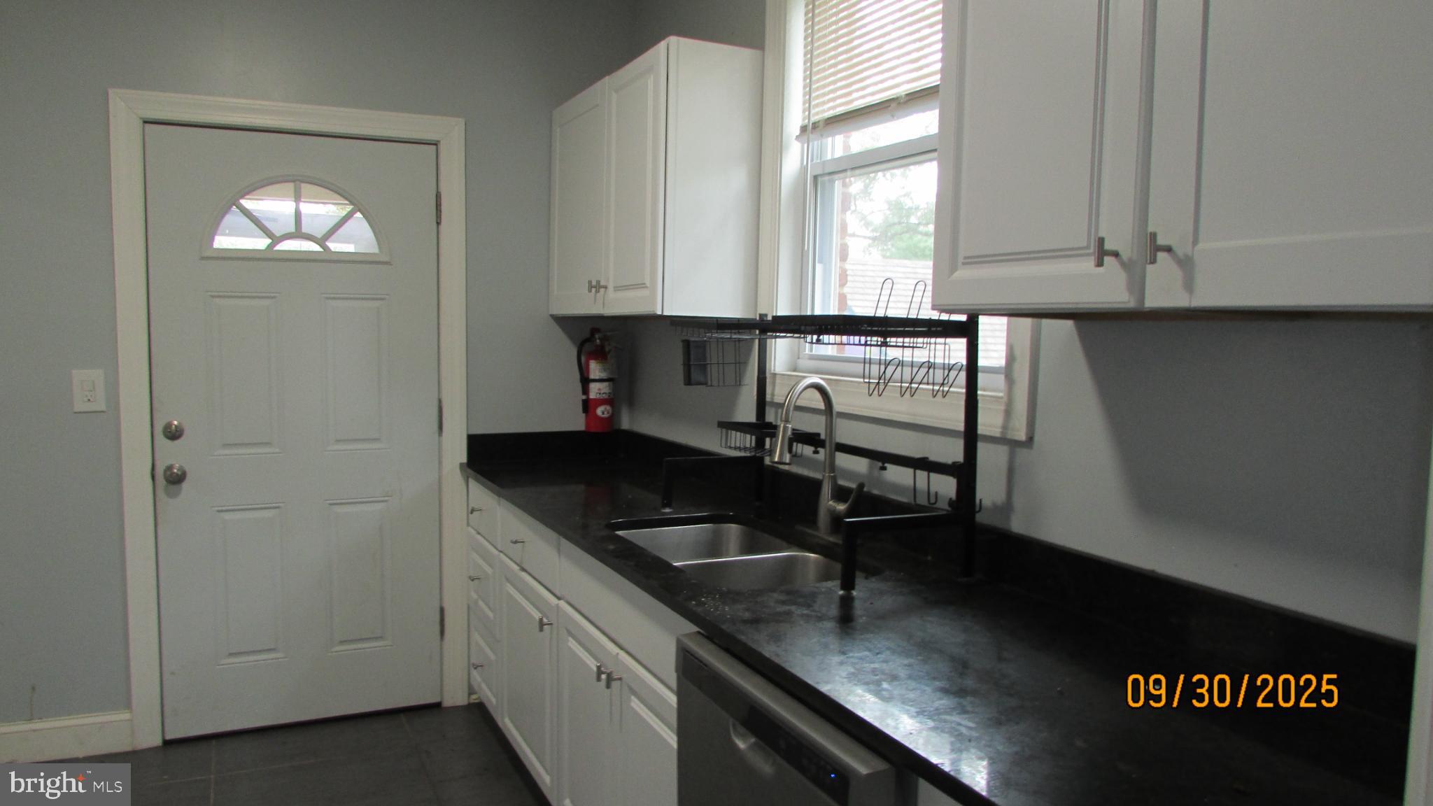 4501 Beechwood Road College Park, MD 20740 - Photo 9 of 57 a kitchen with a sink and cabinets