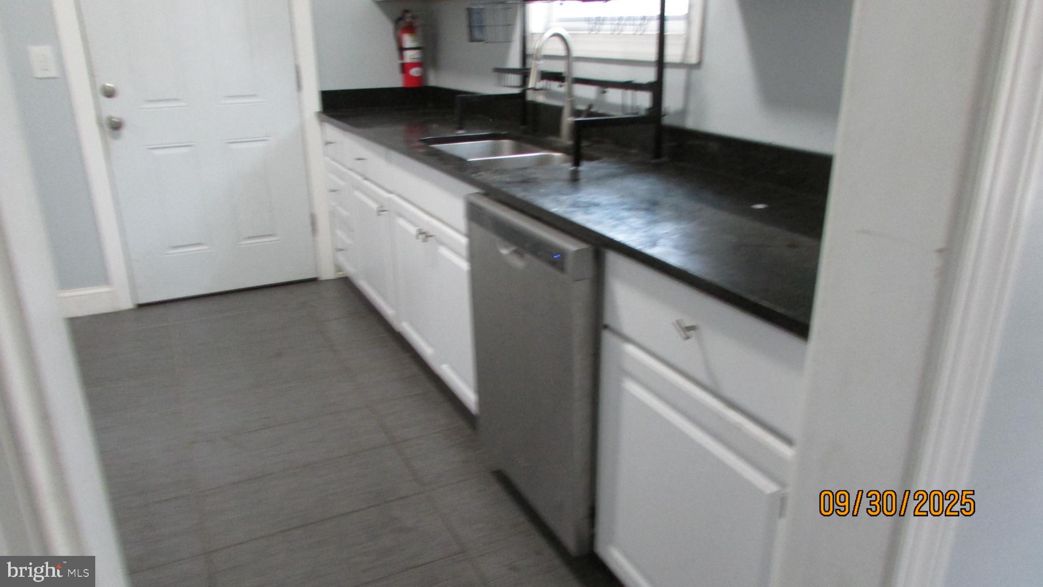 4501 Beechwood Road College Park, MD 20740 - Photo 10 of 57 a kitchen with stainless steel appliances granite countertop a sink and a stove