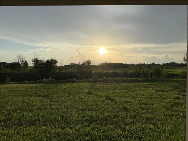 a view of a field with an outdoor space
