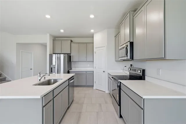 a view of a hallway with white walls and entryway