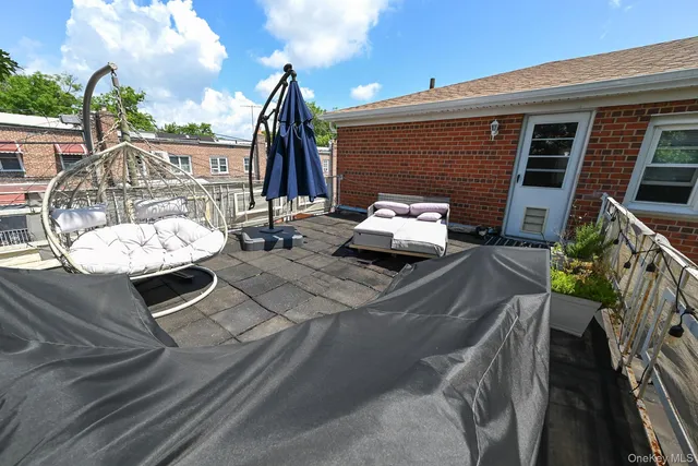 a view of a backyard with sitting area