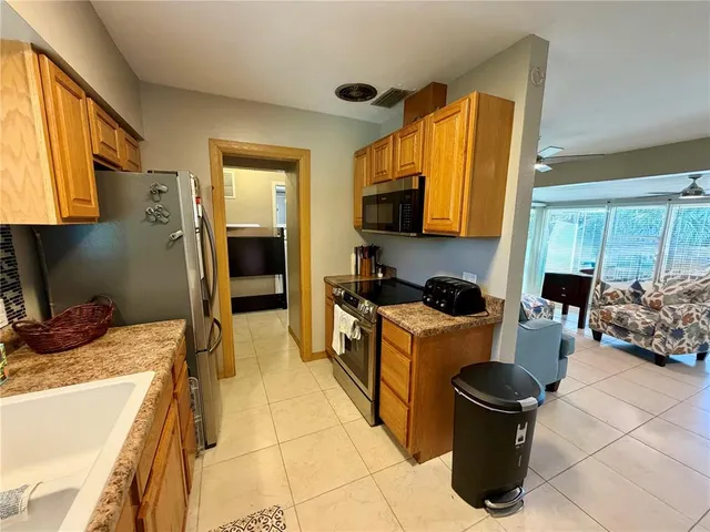 a kitchen with a stove and a refrigerator