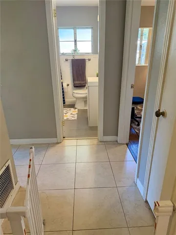a view of a bathroom with a sink and a mirror