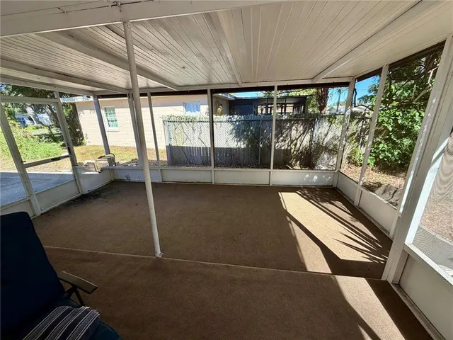 a view of an empty room with a balcony