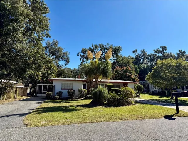 a view of house with swimming pool