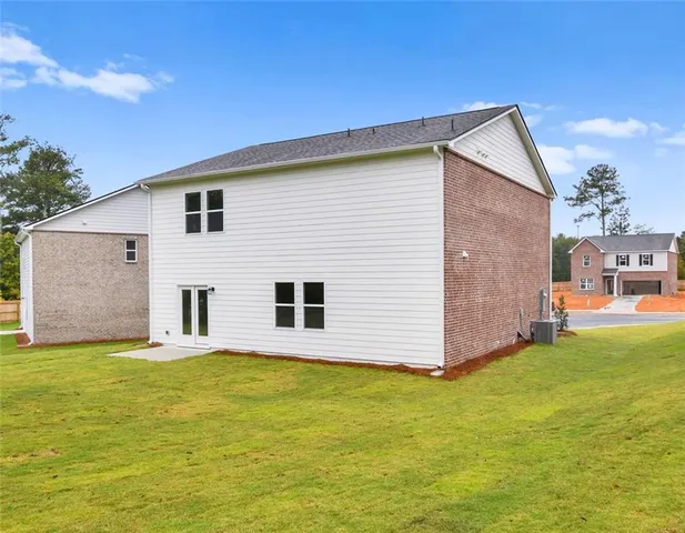 a view of a backyard with a garden and yard