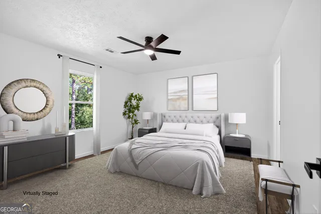 a bedroom with a bed and window