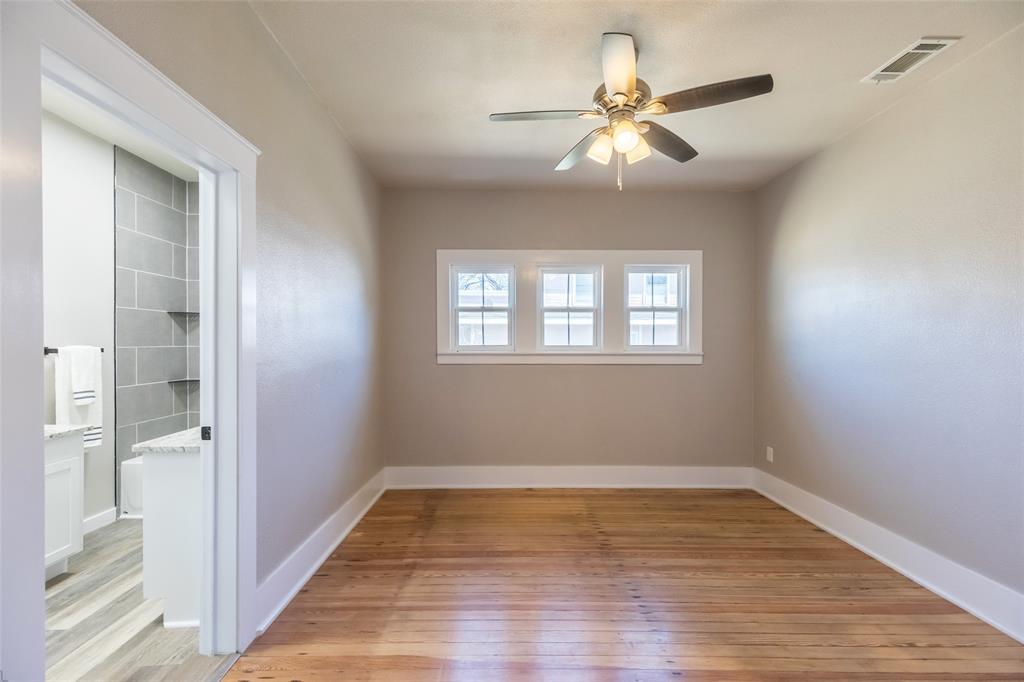 601 North Ave G Haskell, TX 79521 - Photo 20 of 36 a view of empty room with wooden floor and fan
