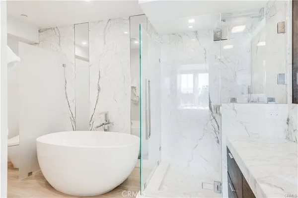 a bathroom with a bathtub and a sink