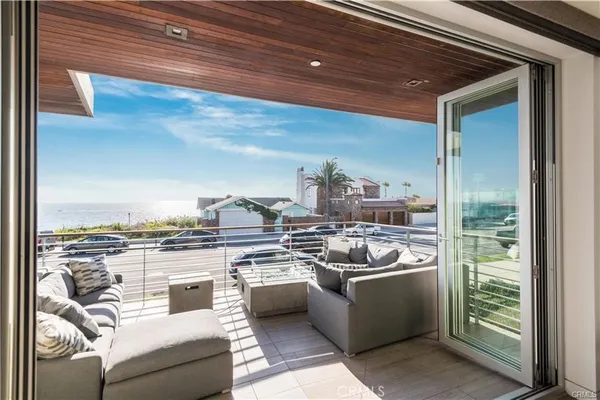 a view of a terrace with wooden floor and outdoor seating