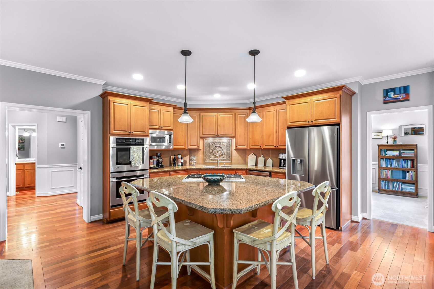 2029 240th Place Southeast Bothell, WA 98021 - Photo 11 of 39 a kitchen with stainless steel appliances a dining table chairs and granite counter tops