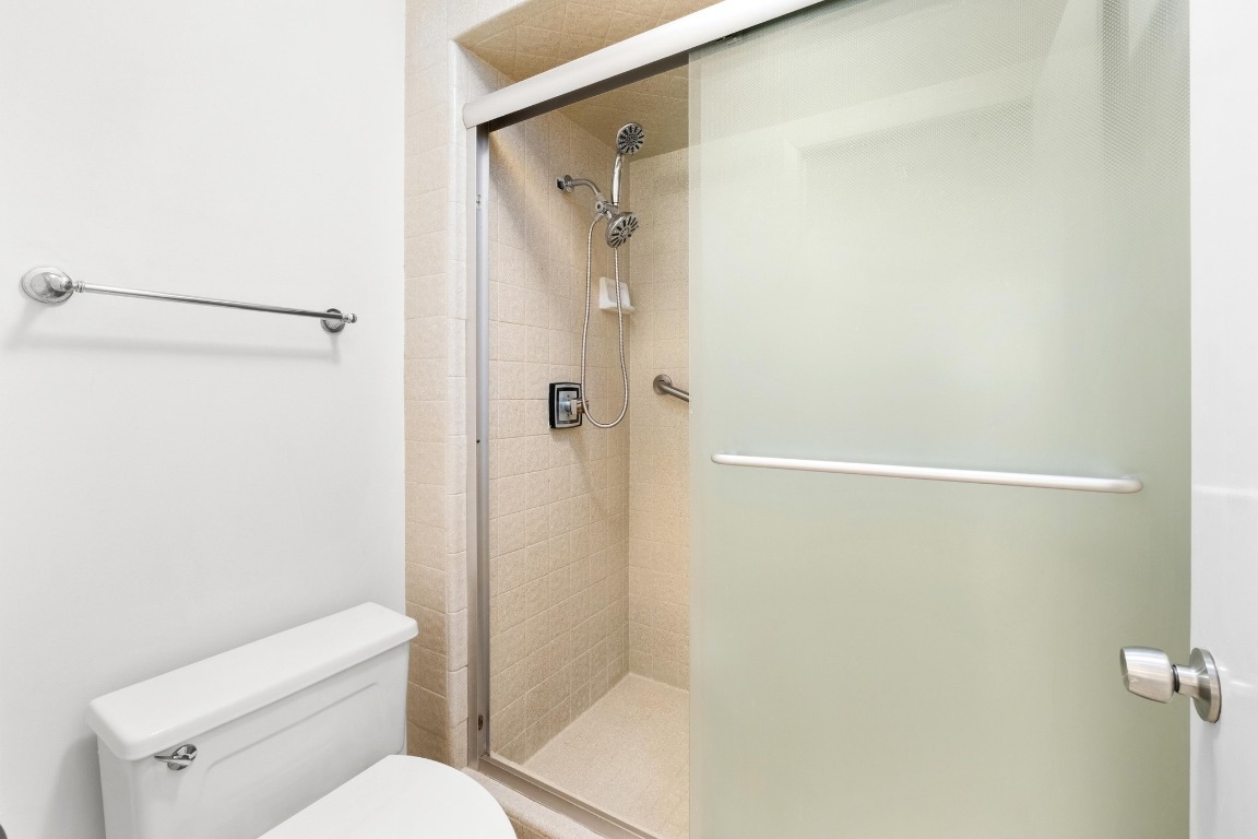 40 North Interstate Highway 35, Unit 3D3 Austin, TX 78701 - Photo 19 of 38 a white toilet sitting next to a shower