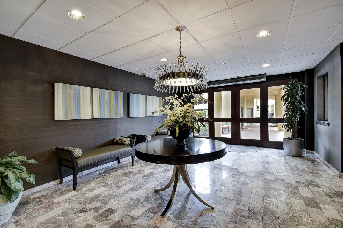40 North Interstate Highway 35, Unit 3D3 Austin, TX 78701 - Photo 36 of 38 a living room with furniture and a chandelier