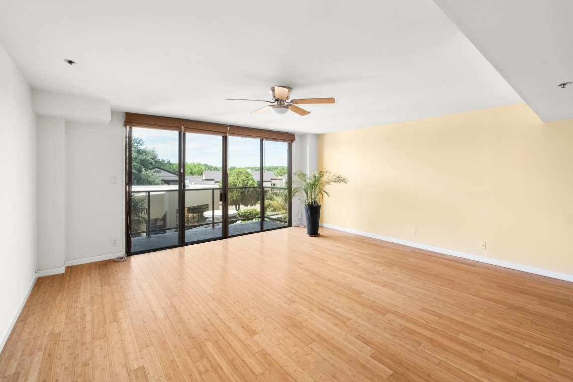 40 North Interstate Highway 35, Unit 3D3 Austin, TX 78701 - Photo 5 of 38 wooden floor in an empty room with a window