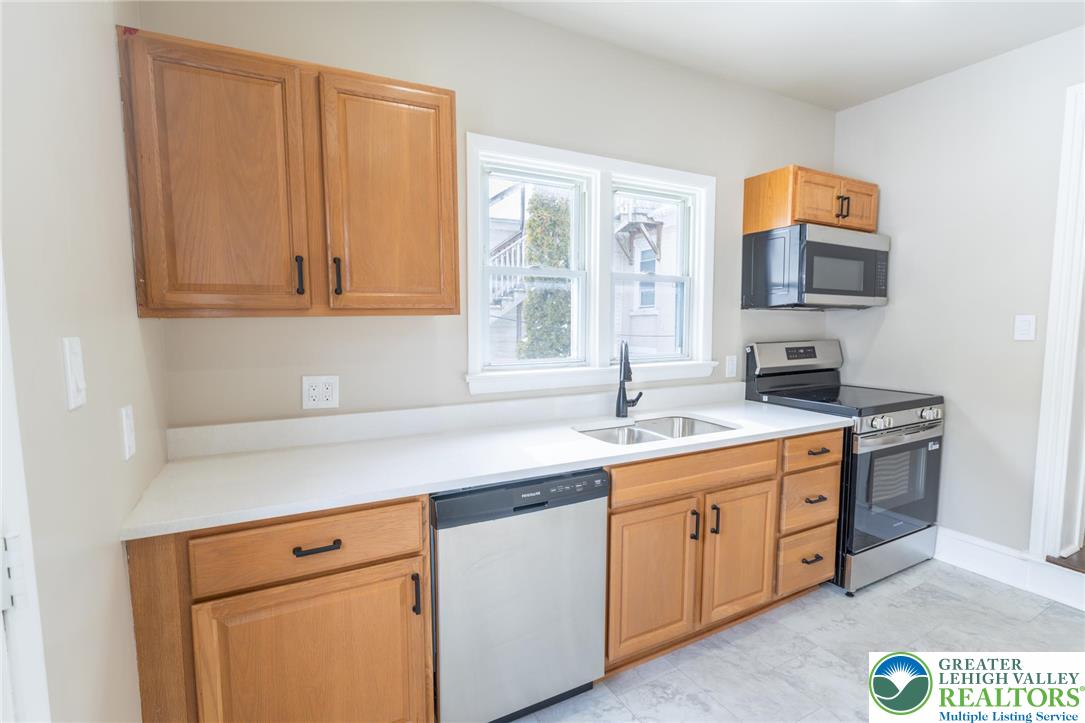 706 Main Street, Unit 2 Bethlehem, PA 18018 - Photo 16 of 20 a kitchen with a sink and cabinets