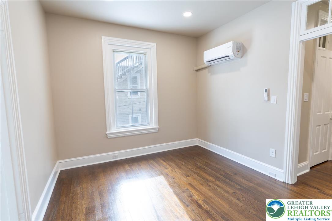 706 Main Street, Unit 2 Bethlehem, PA 18018 - Photo 6 of 20 a view of room with window and hardwood floor
