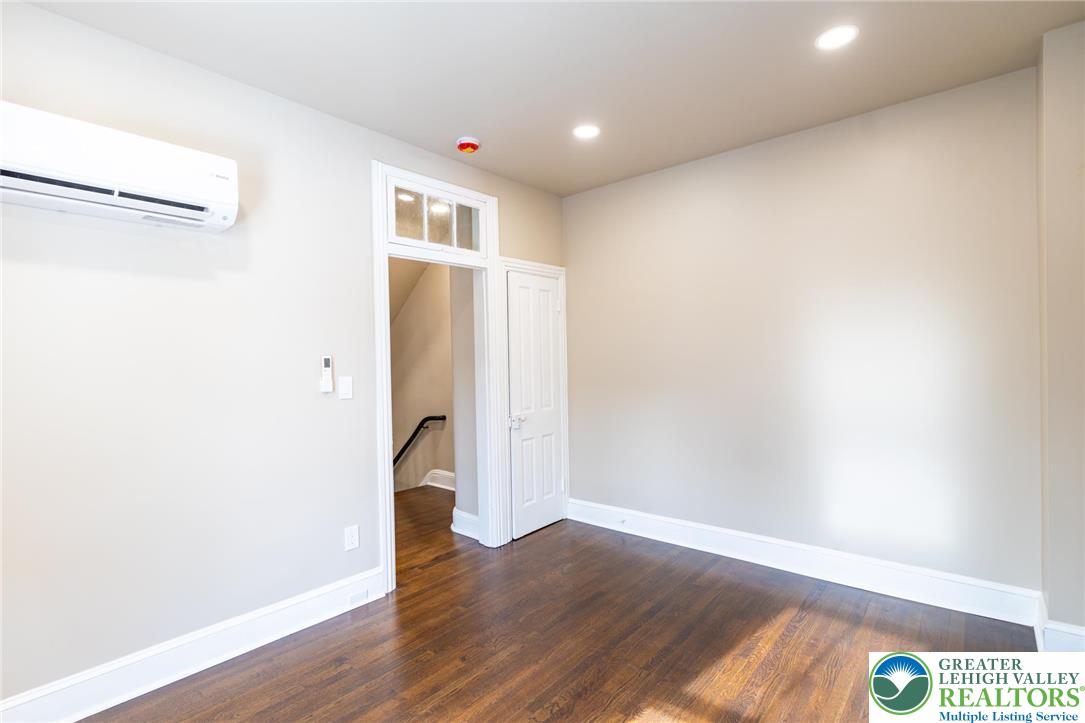 706 Main Street, Unit 2 Bethlehem, PA 18018 - Photo 9 of 20 a view of an empty room with wooden floor