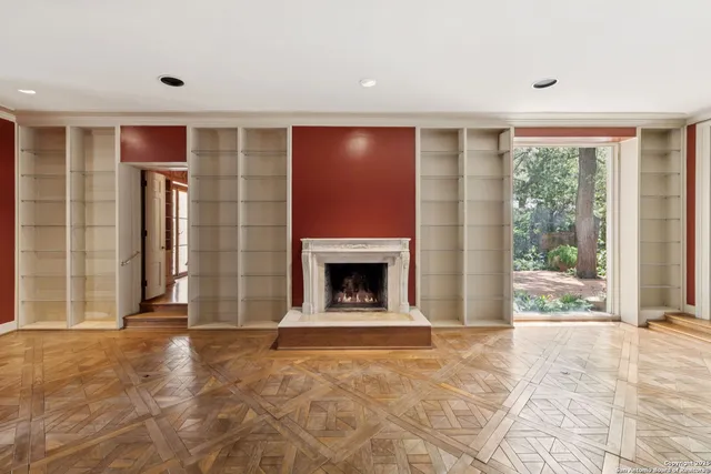 a very nice looking room with a large window and chandelier