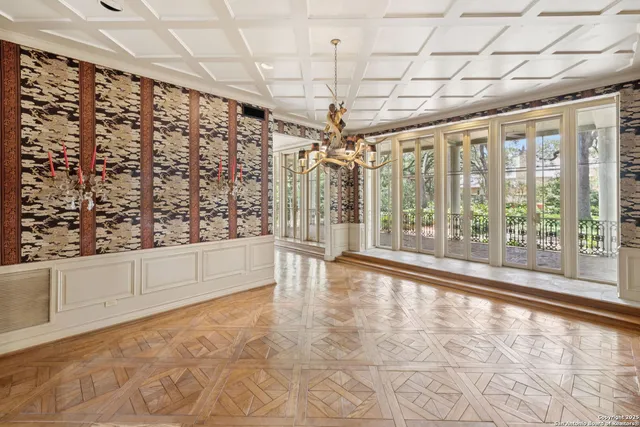 a spacious bathroom with a double vanity sink a mirror and a shower