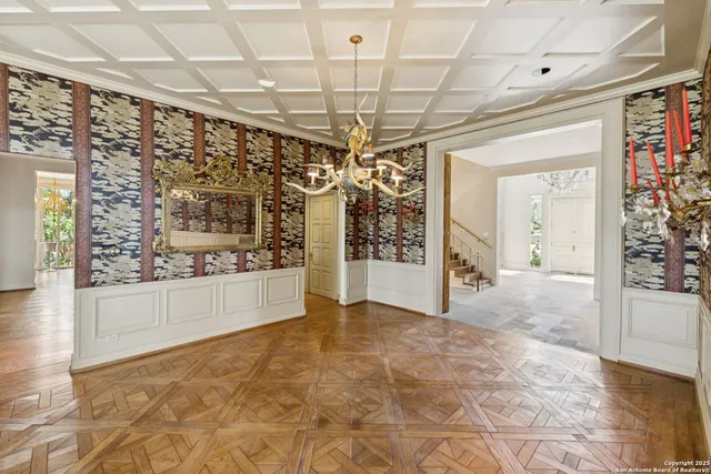 a view of a hallway with wooden floor and entryway