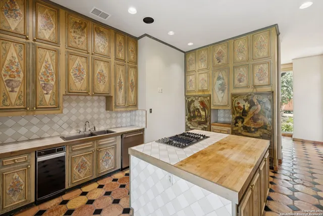 a view of an empty room with a fireplace and a window