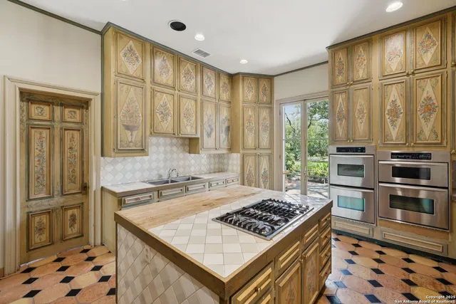 a view of an entryway with floor to ceiling windows