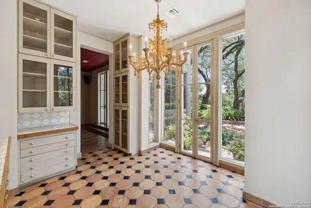 a kitchen with stainless steel appliances granite countertop a refrigerator and a cabinets