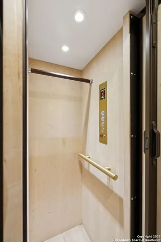 a bathroom with a sink a mirror and a shower