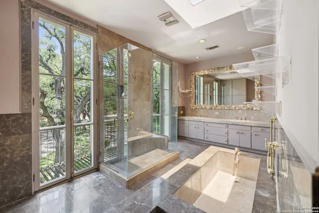 a view of a road with plants and trees