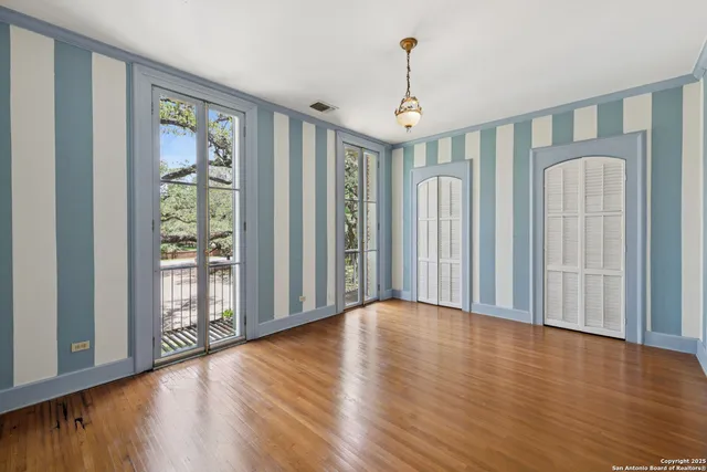 a view of a tree in front of a house