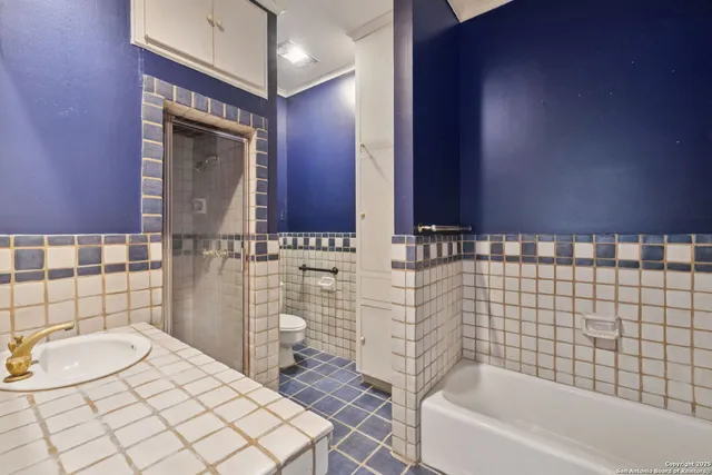 a large tree in front of a house