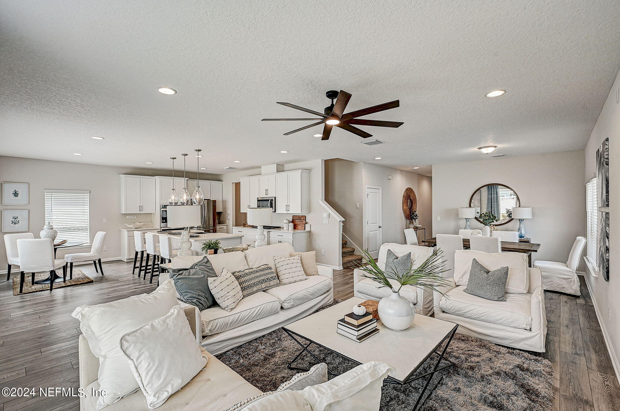 433 Watervale Drive St. Augustine, FL 32092 - Photo 12 of 66 a living room with furniture kitchen view and a chandelier