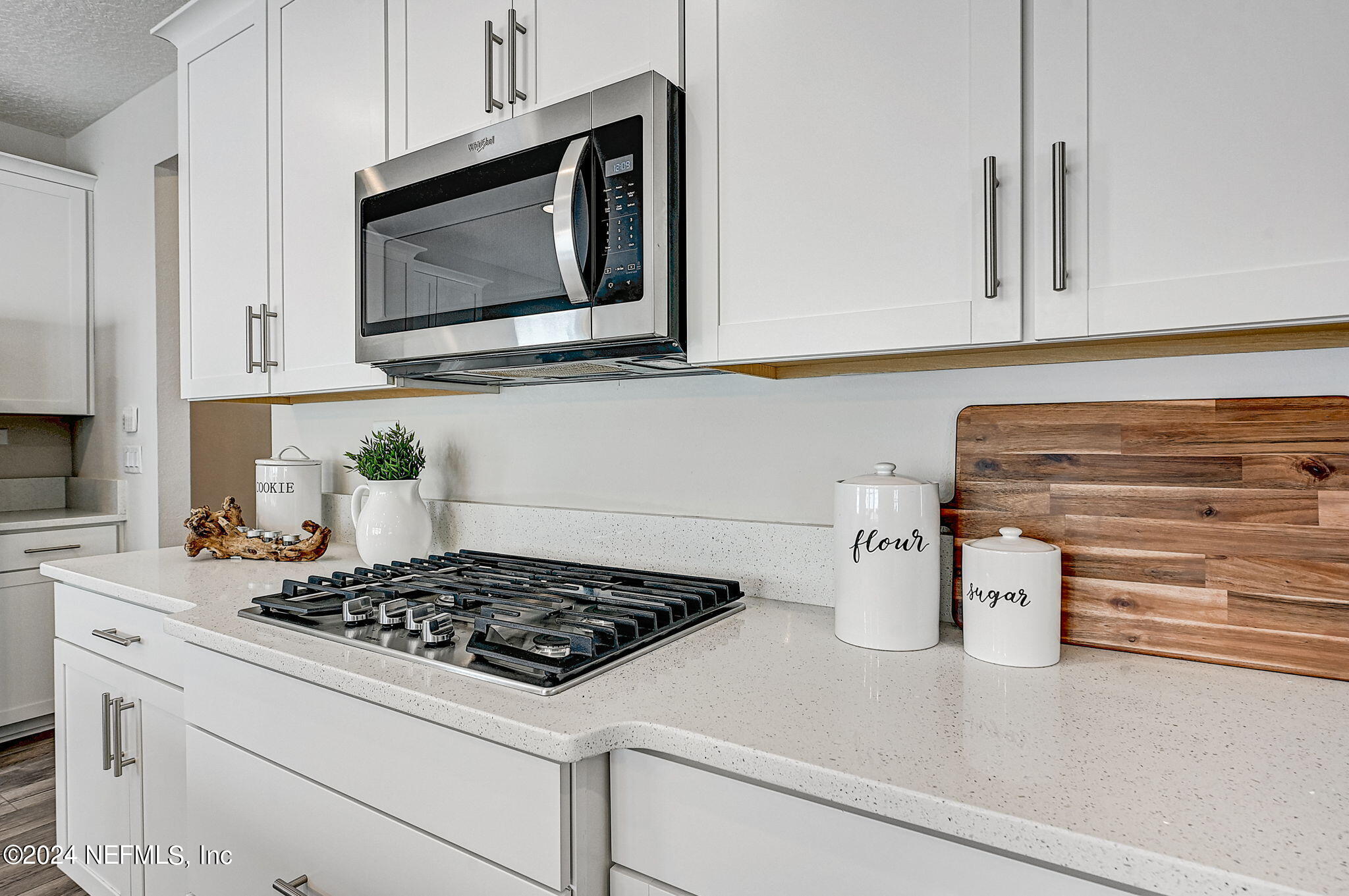 433 Watervale Drive St. Augustine, FL 32092 - Photo 13 of 66 a kitchen with a stove and a microwave