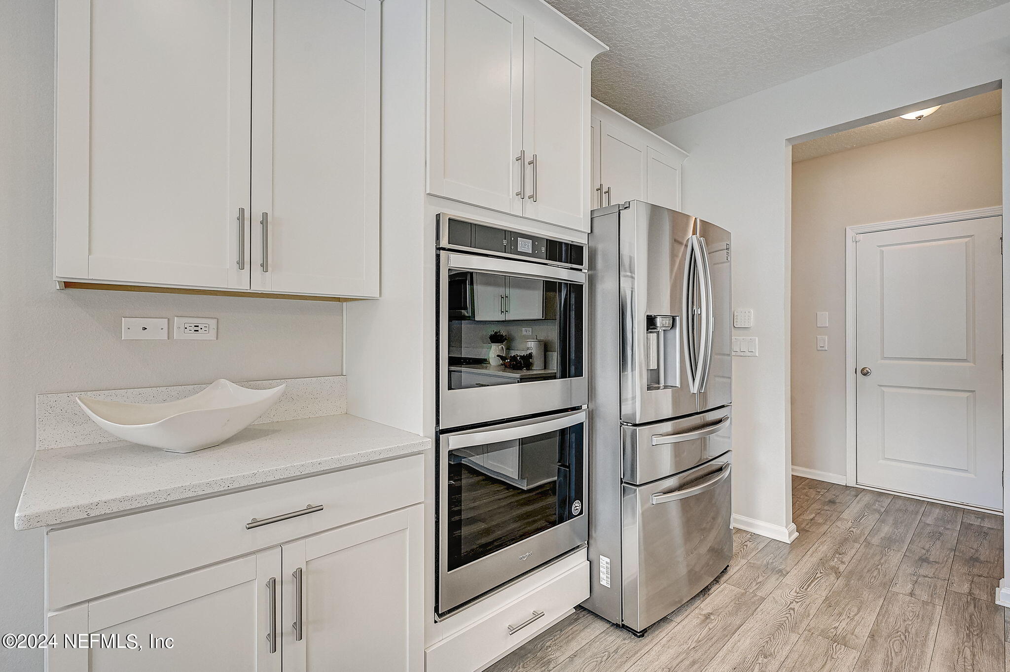 433 Watervale Drive St. Augustine, FL 32092 - Photo 17 of 66 a kitchen with stainless steel appliances white cabinets and a refrigerator