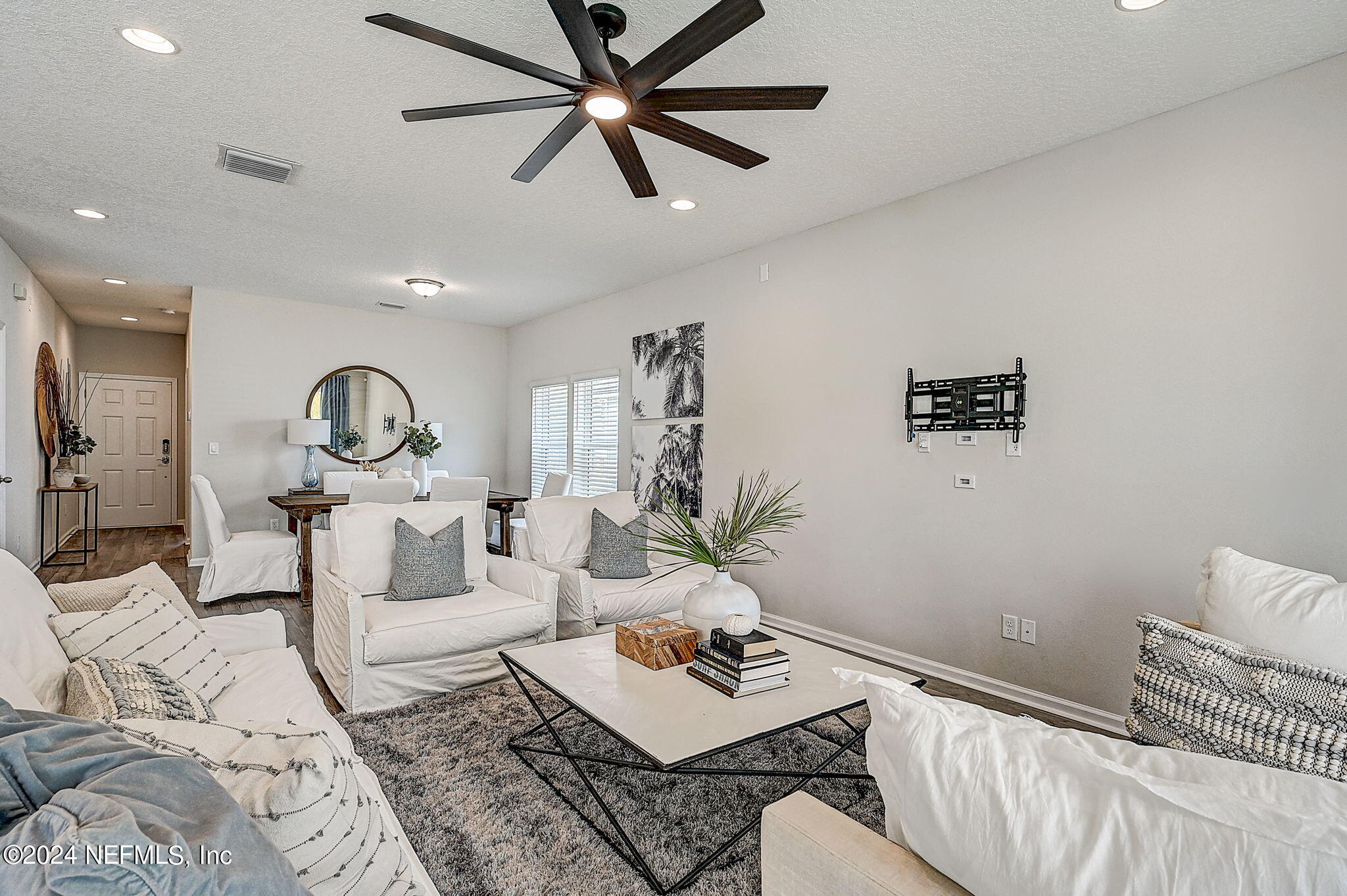 433 Watervale Drive St. Augustine, FL 32092 - Photo 20 of 66 a living room with furniture and a wooden floor