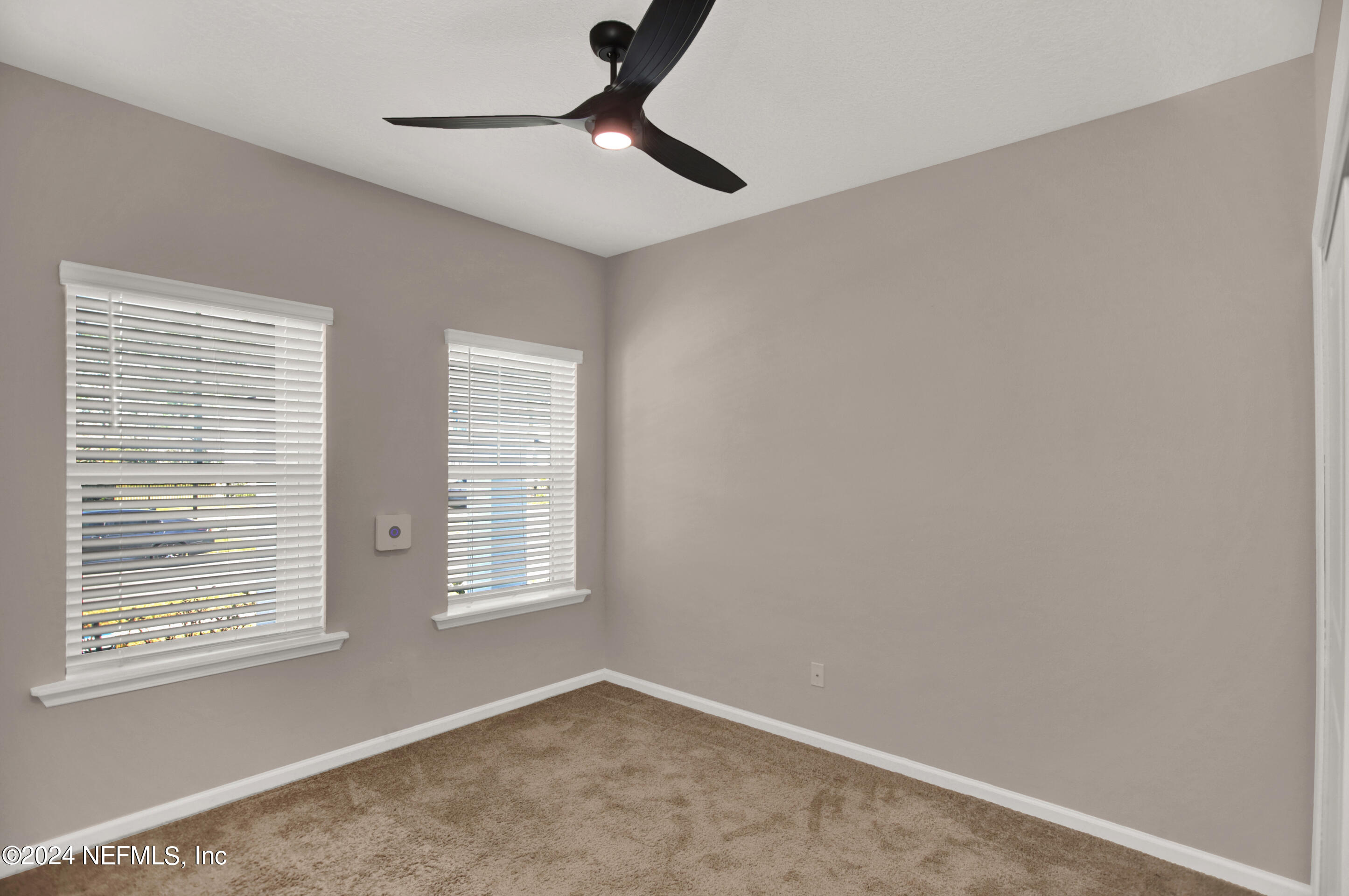 433 Watervale Drive St. Augustine, FL 32092 - Photo 21 of 66 a view of an empty room with a window