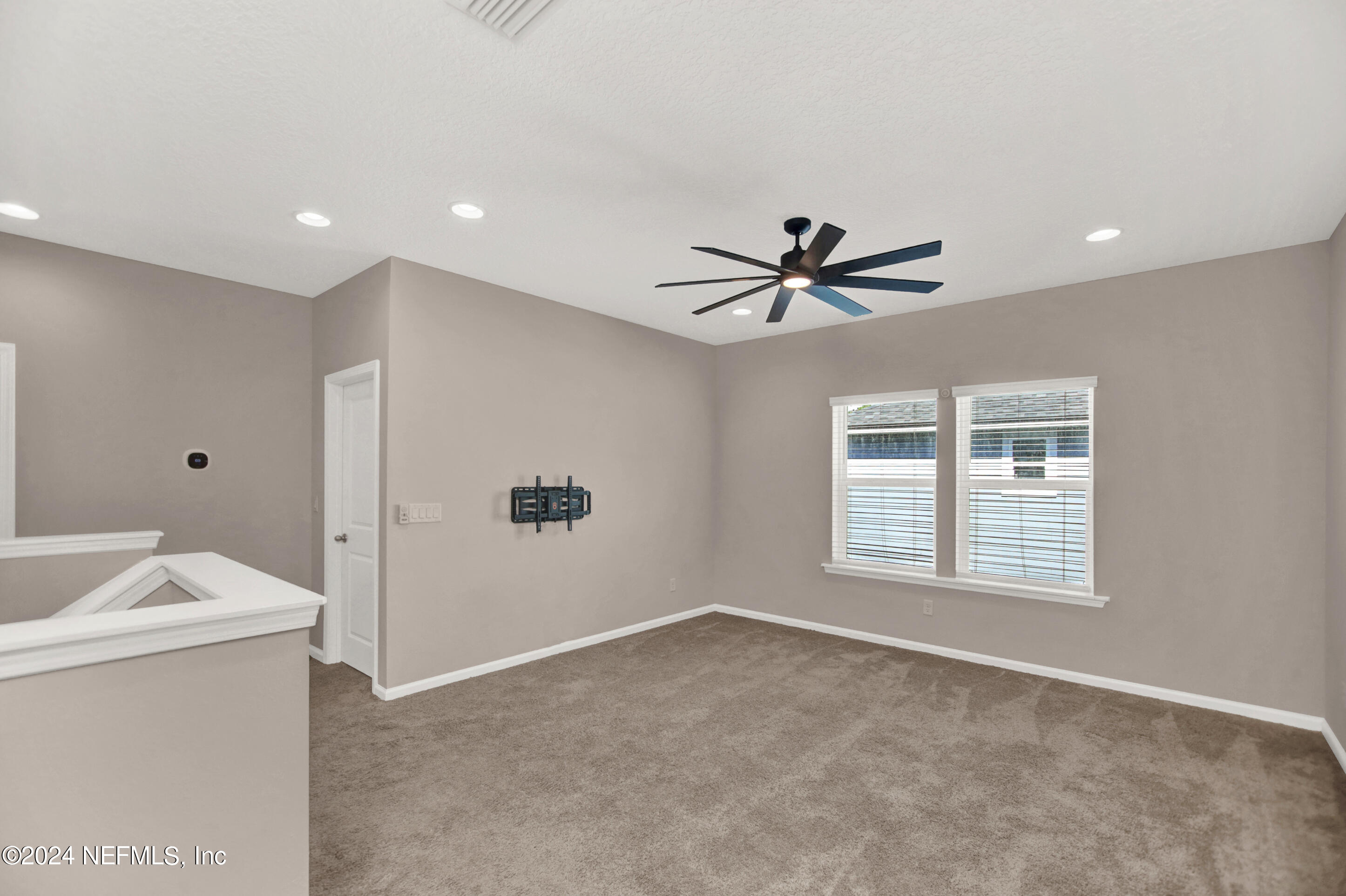 433 Watervale Drive St. Augustine, FL 32092 - Photo 24 of 66 a view of a livingroom with a ceiling fan & a ceiling fan