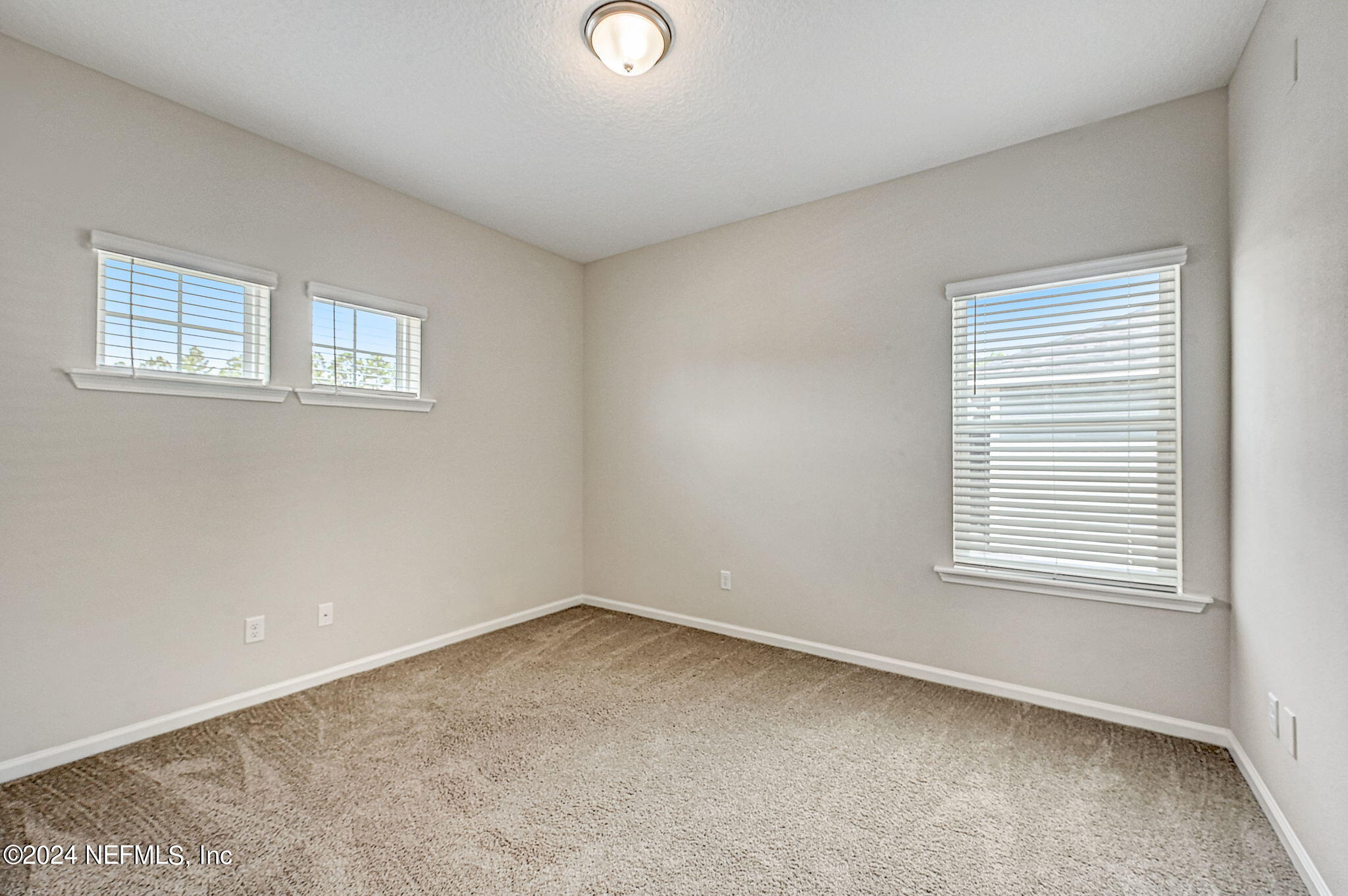 433 Watervale Drive St. Augustine, FL 32092 - Photo 30 of 66 a view of an empty room with a window