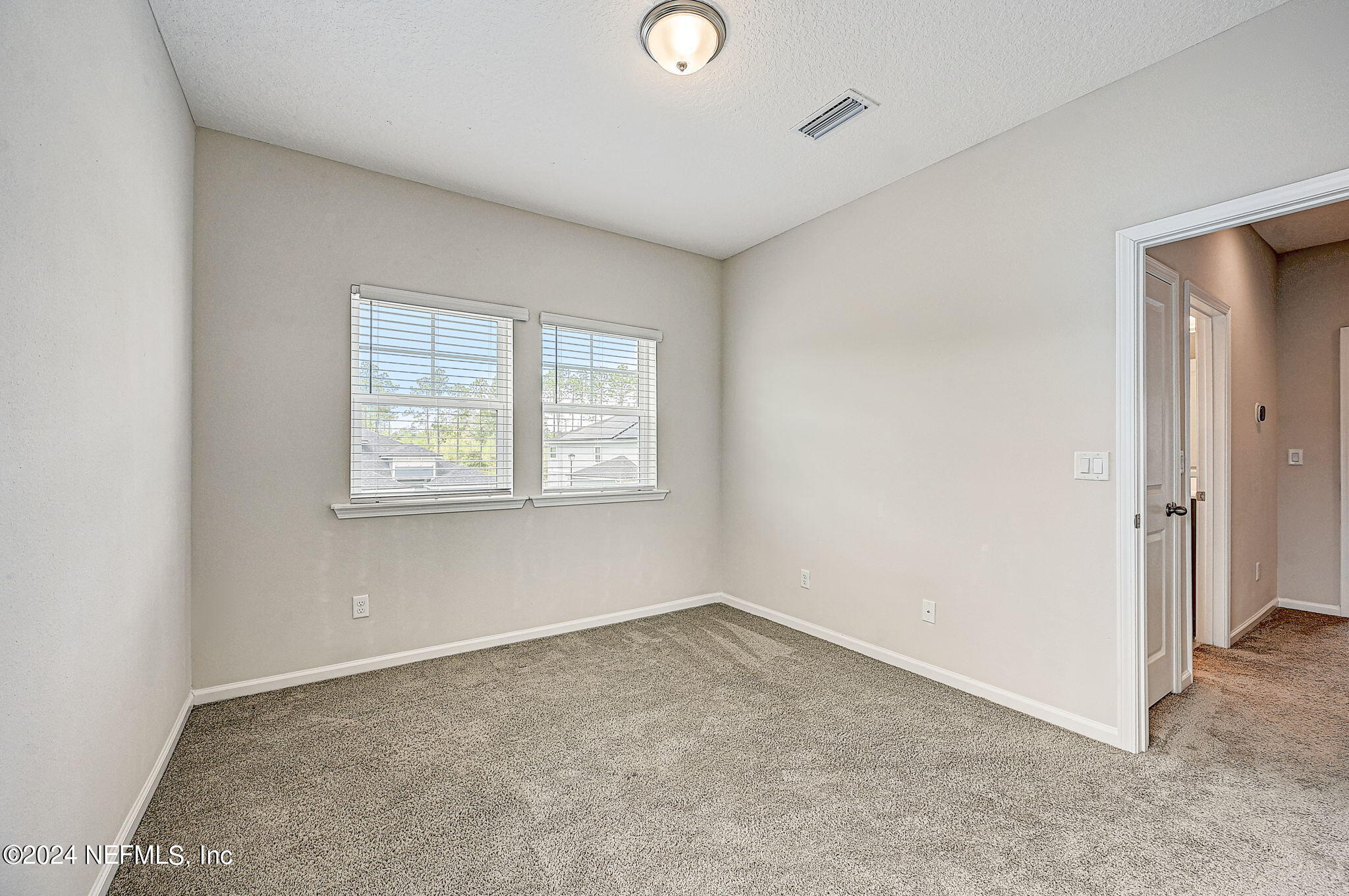 433 Watervale Drive St. Augustine, FL 32092 - Photo 37 of 66 an empty room with windows and closet